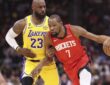 Houston Rockets forward Kevin Durant #7 dribbles the ball against defense from Los Angeles Lakers forward LeBron James #23 at Toyota Center.