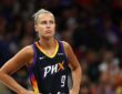 Phoenix Mercury guard Kitija Laksa stands with hands on hips during a game against the Sparks.