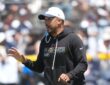 Dallas Cowboys offensive coordinator Klayton Adams gestures while calling out instructions during a training camp practice.