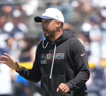 Dallas Cowboys offensive coordinator Klayton Adams gestures while calling out instructions during a training camp practice.