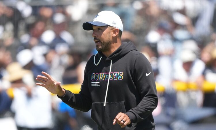 Dallas Cowboys offensive coordinator Klayton Adams gestures while calling out instructions during a training camp practice.