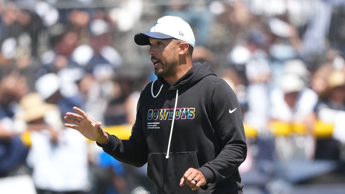 Dallas Cowboys offensive coordinator Klayton Adams gestures while calling out instructions during a training camp practice.