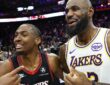 Los Angeles Lakers forward LeBron James #23 meets with Philadelphia 76ers guard Tyrese Maxey after the game at Xfinity Mobile Arena.