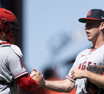 Los Angeles Angels catcher Logan O'Hoppe shakes hands with pitcher Mitch Farris after a win at Oracle Park.