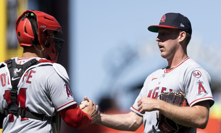 Los Angeles Angels catcher Logan O'Hoppe shakes hands with pitcher Mitch Farris after a win at Oracle Park.