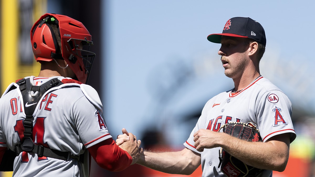 Los Angeles Angels catcher Logan O'Hoppe shakes hands with pitcher Mitch Farris after a win at Oracle Park.