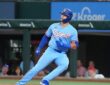 Texas Rangers designated hitter Logan O'Hoppe runs up the first base line after a single at Globe Life Field.
