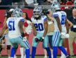 Dallas Cowboys running back Malik Davis celebrates a touchdown with teammates Nick Leverett and Jonathan Mingo.