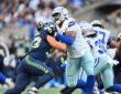 Dallas Cowboys offensive tackle Marcellus Johnson locks up Seattle Seahawks linebacker Aidan Hubbard at the line.