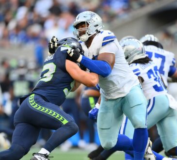 Dallas Cowboys offensive tackle Marcellus Johnson locks up Seattle Seahawks linebacker Aidan Hubbard at the line.