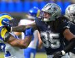 Dallas Cowboys linebacker Marist Liufau grabs Rams running back Cody Schrader by the shoulder after a play.