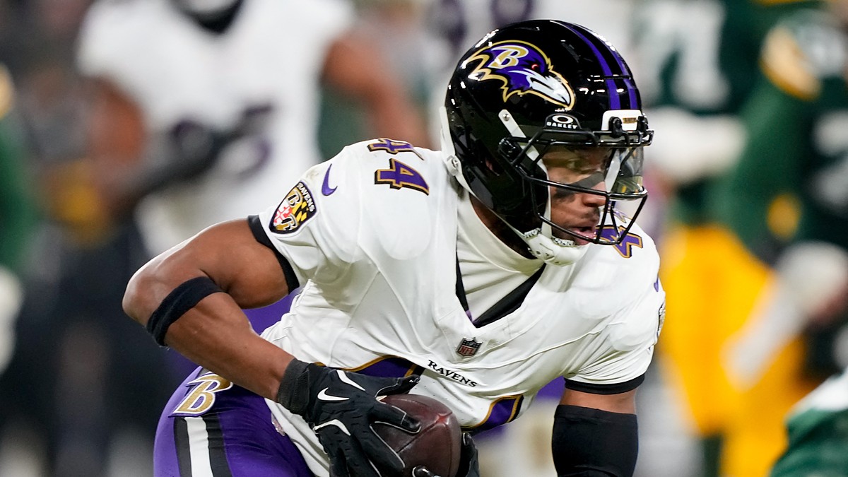 Baltimore Ravens cornerback Marlon Humphrey secures an interception and turns upfield against the Green Bay Packers.