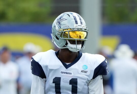 Dallas Cowboys wide receiver Marquez Valdes-Scantling stands in a gold visor during joint practice with the Rams.