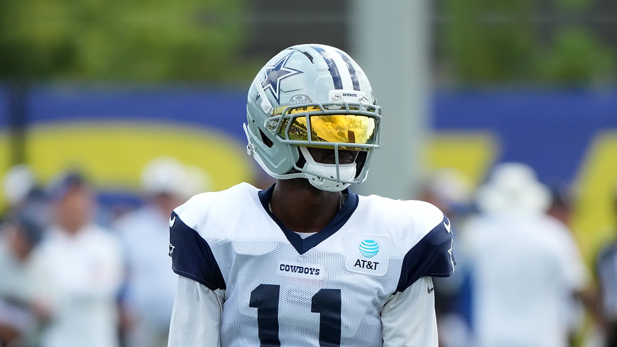 Dallas Cowboys wide receiver Marquez Valdes-Scantling stands in a gold visor during joint practice with the Rams.