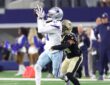 Dallas Cowboys wide receiver Marquez Valdes-Scantling hauls in a pass with a New Orleans Saints defender trailing.
