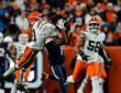 Denver Broncos wide receiver Marvin Mims Jr. reaches back for a catch as Cleveland Browns cornerback Denzel Ward defends.