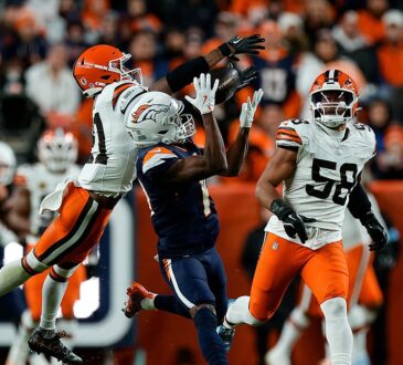 Denver Broncos wide receiver Marvin Mims Jr. reaches back for a catch as Cleveland Browns cornerback Denzel Ward defends.