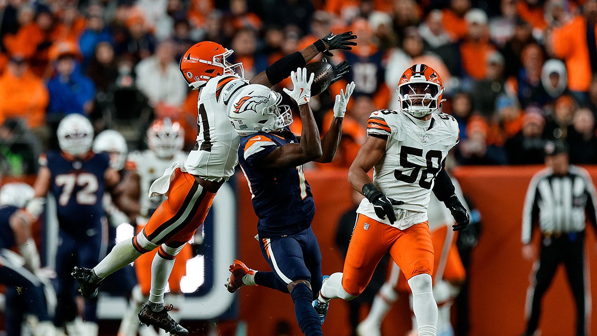 Denver Broncos wide receiver Marvin Mims Jr. reaches back for a catch as Cleveland Browns cornerback Denzel Ward defends.