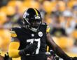 Pittsburgh Steelers offensive tackle Max Iheanachor sets his hands to block during a preseason game.