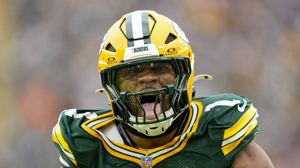 Green Bay Packers defensive end Micah Parsons roars in celebration after a sack while wearing his No. 1 jersey.