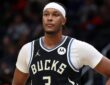 Milwaukee Bucks center Myles Turner stands with a hand on his hip during a stoppage at Capital One Arena.