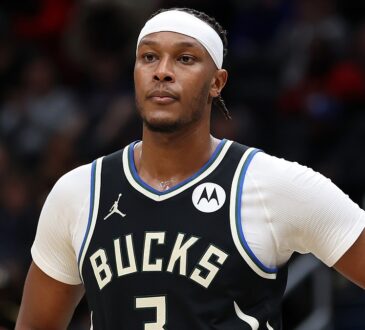 Milwaukee Bucks center Myles Turner stands with a hand on his hip during a stoppage at Capital One Arena.