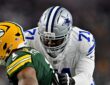 Dallas Cowboys offensive tackle Nathan Thomas locks up with Green Bay Packers defensive end Micah Parsons in pass protection.