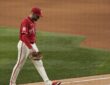 Texas Rangers pitcher Nathan Eovaldi walks off the field with his head down after being pulled against the Orioles.