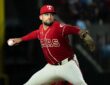 Texas Rangers starting pitcher Nathan Eovaldi rocks into his delivery with the ball hidden behind his hip.
