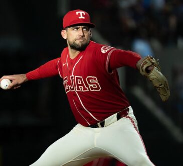Texas Rangers starting pitcher Nathan Eovaldi rocks into his delivery with the ball hidden behind his hip.