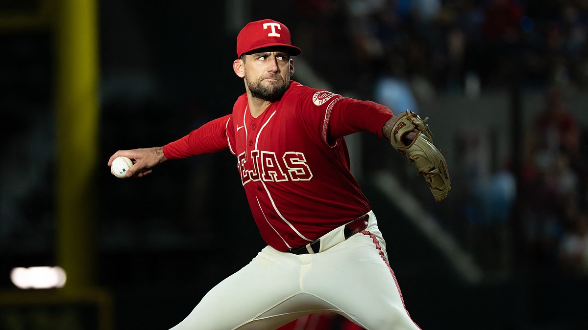 Texas Rangers starting pitcher Nathan Eovaldi rocks into his delivery with the ball hidden behind his hip.
