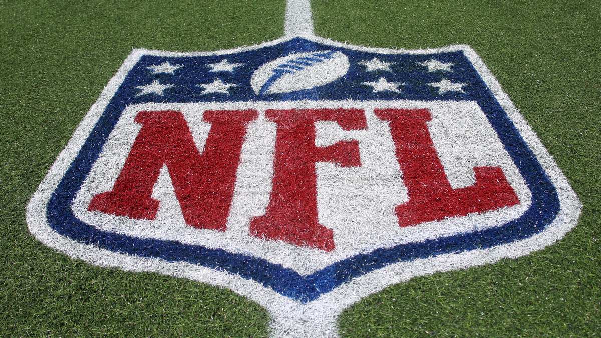 The NFL shield logo painted on the field at Tom Benson Hall of Fame Stadium.