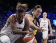 Toronto Tempo forward Nyara Sabally pulls the ball away as Dallas Wings forward Alanna Smith reaches in.