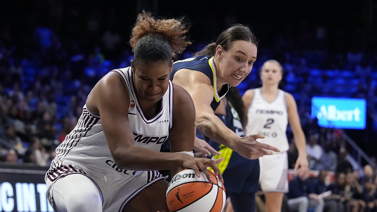 Toronto Tempo forward Nyara Sabally pulls the ball away as Dallas Wings forward Alanna Smith reaches in.