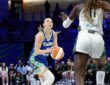 Dallas Wings guard Paige Bueckers rises for a shot as Storm center Awa Fam contests at College Park Center.