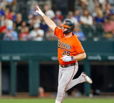 Baltimore Orioles first baseman Pete Alonso points as he rounds the bases after hitting a home run against the Rangers.