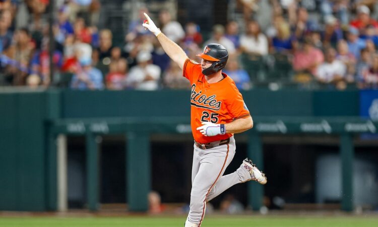 Baltimore Orioles first baseman Pete Alonso points as he rounds the bases after hitting a home run against the Rangers.