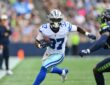 Dallas Cowboys running back Phil Mafah cuts upfield with the ball after a catch as a Seattle Seahawks defender closes in.