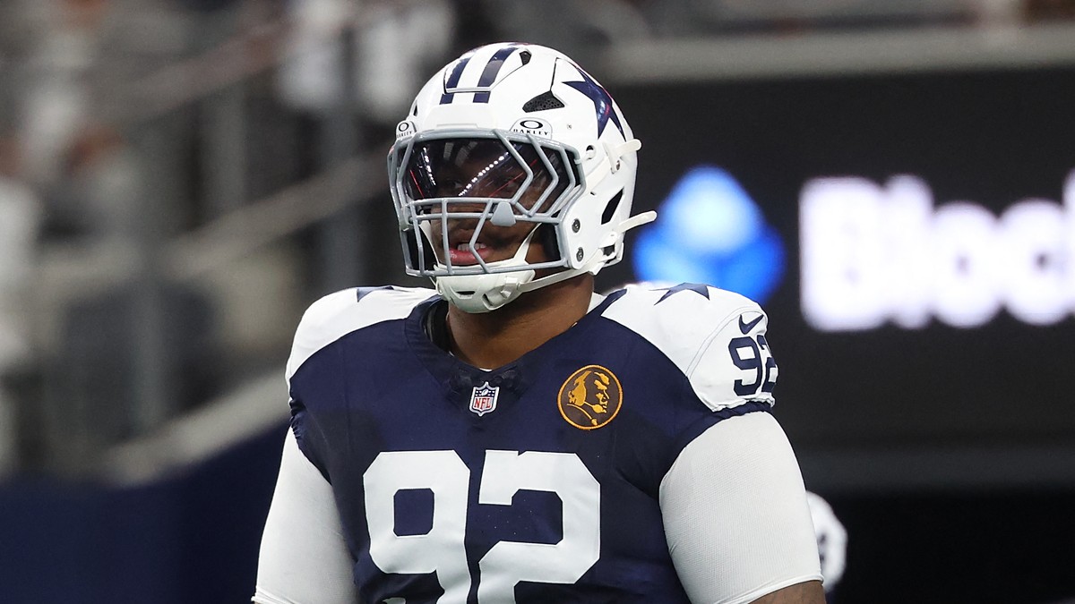 Dallas Cowboys defensive tackle Quinnen Williams stands in full pads during pregame warmups at AT&T Stadium.