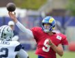 Cowboys defensive tackle Quinnen Williams closes on Rams quarterback Matthew Stafford as he throws in joint practice