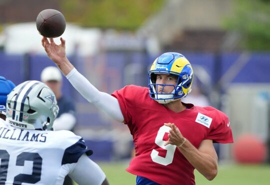 Cowboys defensive tackle Quinnen Williams closes on Rams quarterback Matthew Stafford as he throws in joint practice