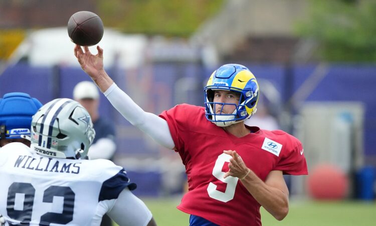 Cowboys defensive tackle Quinnen Williams closes on Rams quarterback Matthew Stafford as he throws in joint practice