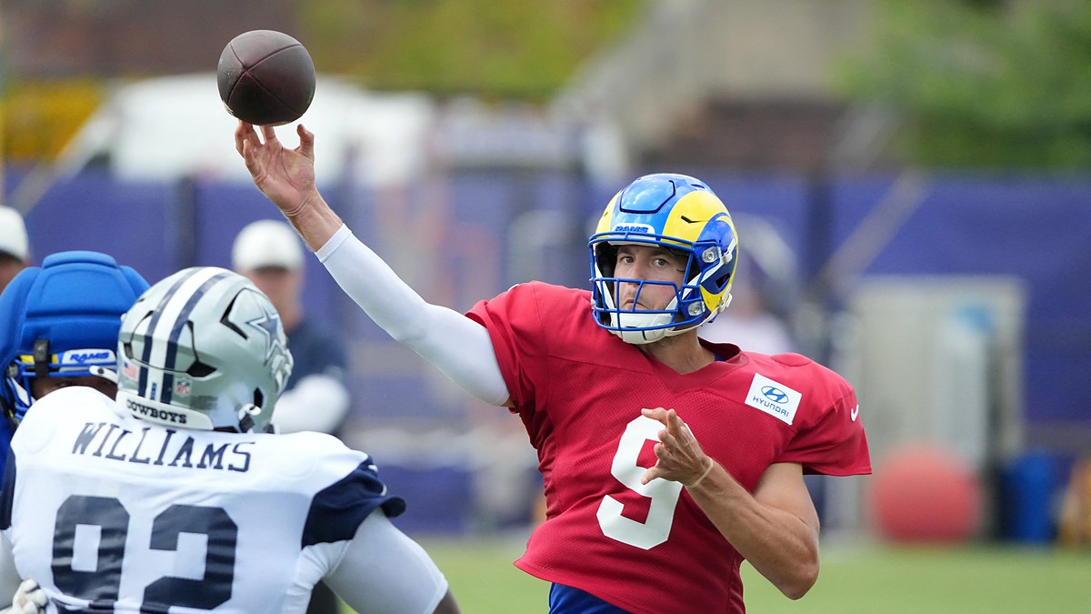 Cowboys defensive tackle Quinnen Williams closes on Rams quarterback Matthew Stafford as he throws in joint practice