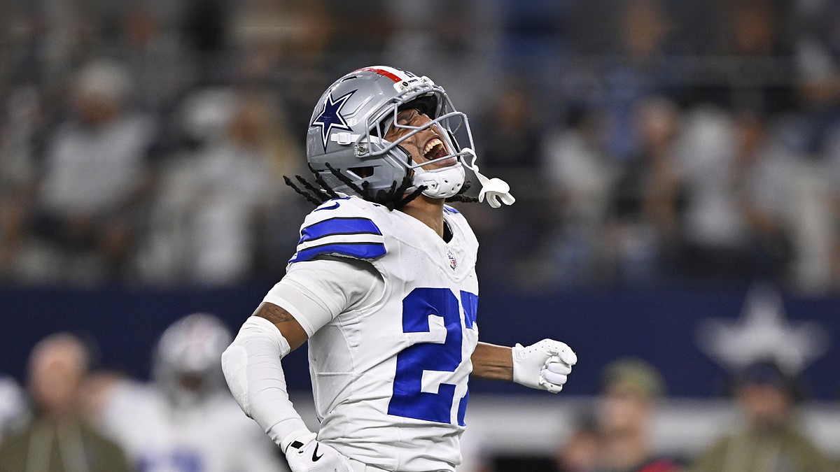 Dallas Cowboys cornerback Reddy Steward throws his head back and shouts, fist clenched, after a sack.