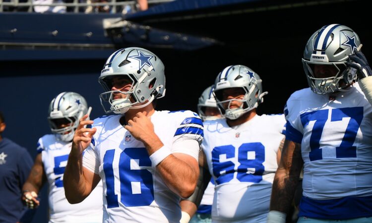 Dallas Cowboys quarterback Sam Howell walks out of the tunnel ahead of teammates before a game at Lumen Field.