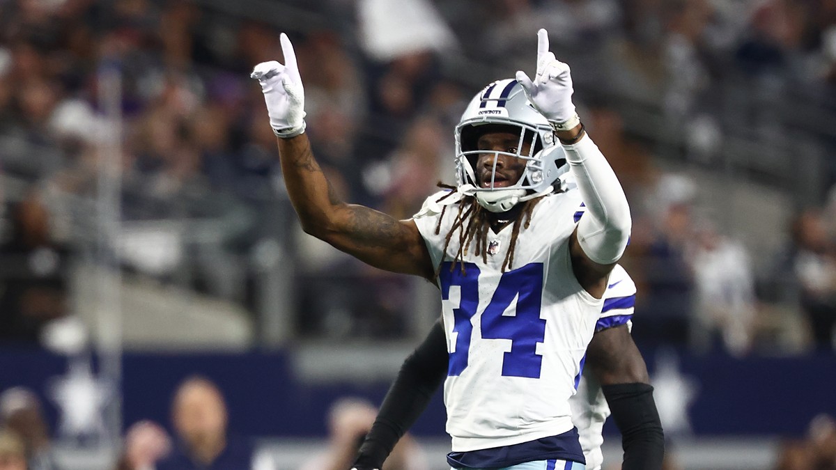 Dallas Cowboys cornerback Shavon Revel Jr. raises both index fingers to celebrate a play against the Minnesota Vikings.