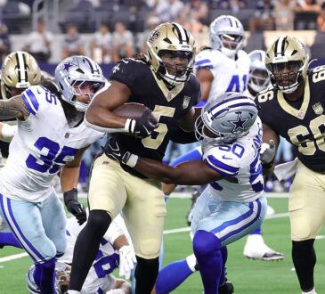 Dallas Cowboys linebacker Shemar James wraps up New Orleans Saints running back Kendre Miller in the backfield.
