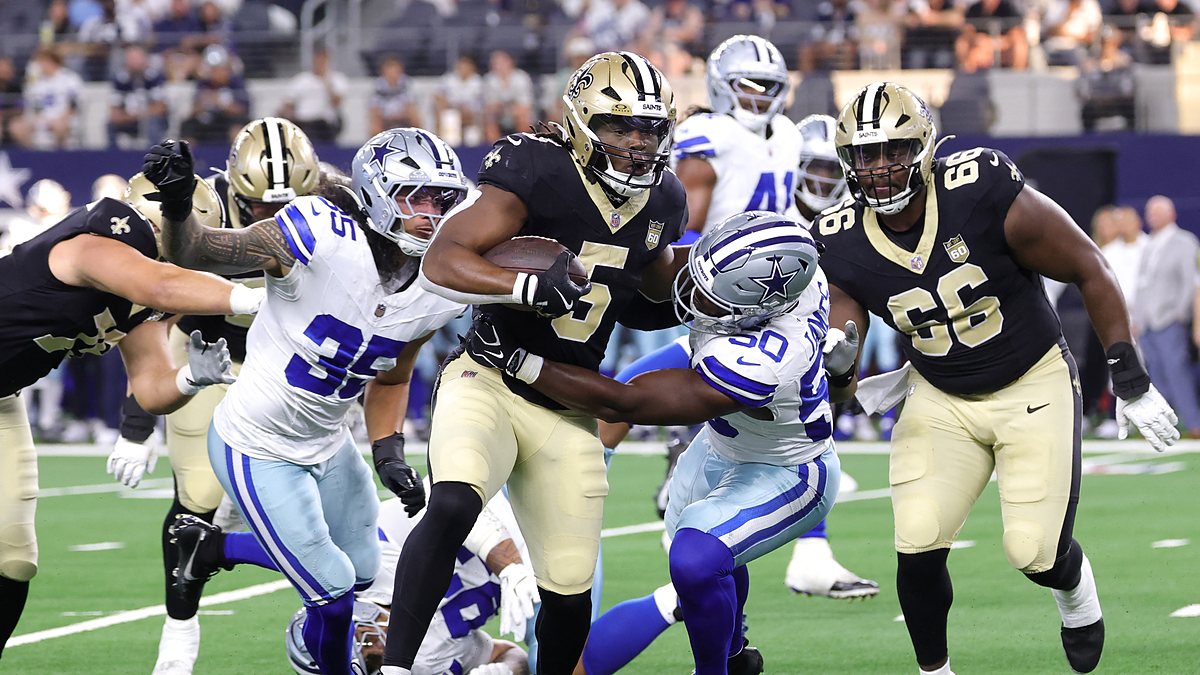 Dallas Cowboys linebacker Shemar James wraps up New Orleans Saints running back Kendre Miller in the backfield.