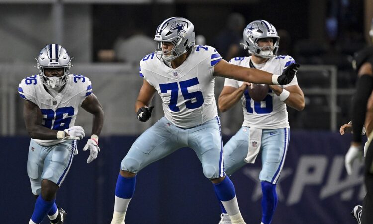 Dallas Cowboys offensive tackle Shiyazh Pete sets in pass protection with the quarterback dropping back behind him.