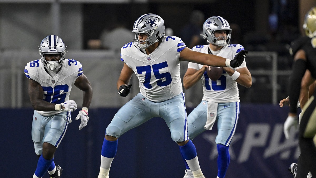 Dallas Cowboys offensive tackle Shiyazh Pete sets in pass protection with the quarterback dropping back behind him.